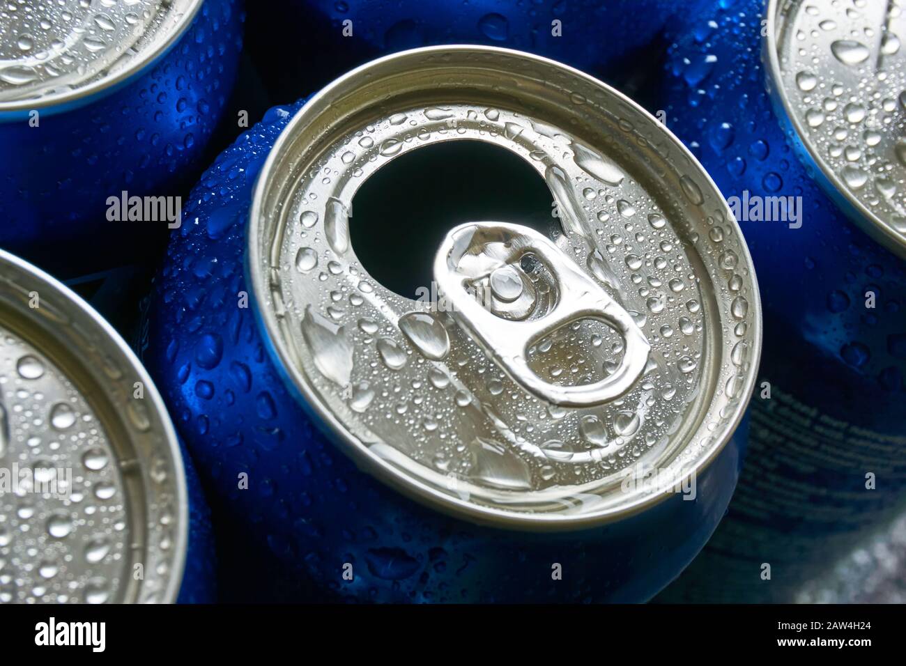 Blue soda cans recycling closeup. Soda cans with open pull tab and