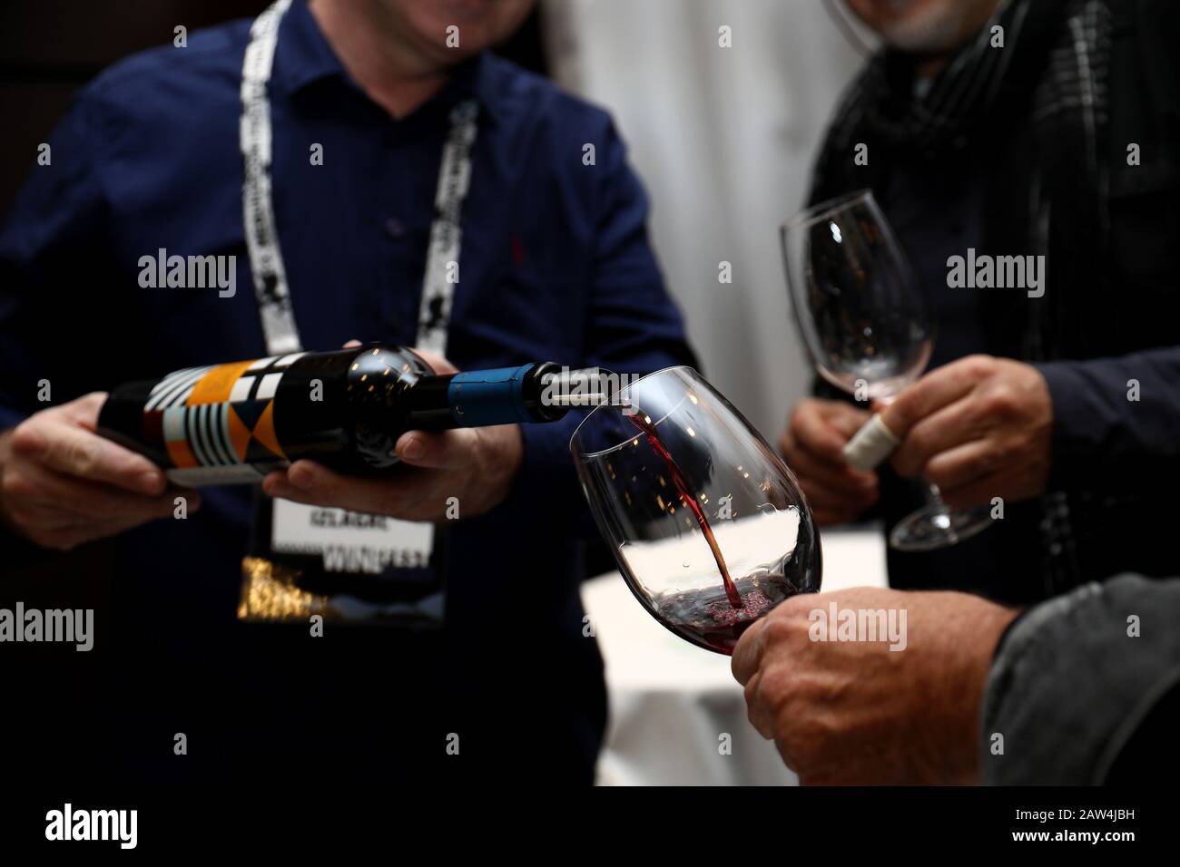 Sarajevo, Bosnia and Herzegovina (BiH). 6th Feb, 2020. An exhibitor pours wine at the Sarajevo Wine Fest, an international wine festival, in Sarajevo, Bosnia and Herzegovina (BiH), on Feb. 6, 2020. The two-day Sarajevo Wine Fest kicked off in Sarajevo on Thursday. The festival presents renowned local and regional wineries. Local distributors showcase wines from France, Spain, Italy, etc. Credit: Nedim Grabovica/Xinhua/Alamy Live News Stock Photo