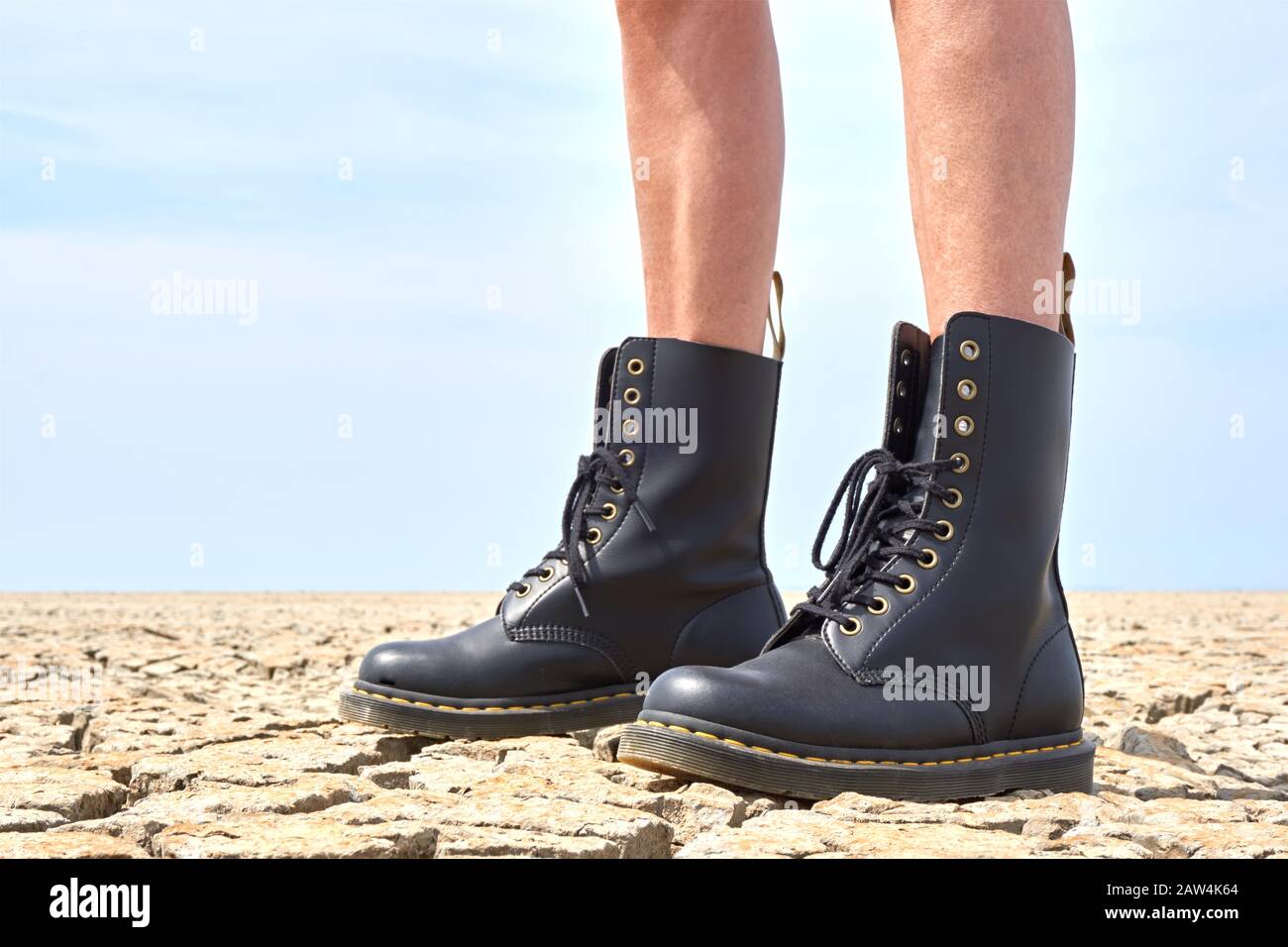 Franeker / The Netherlands - June 02 2019: Legs of a woman with Dr Martens  1460 Vegan Black shoes on cracked ground Stock Photo - Alamy