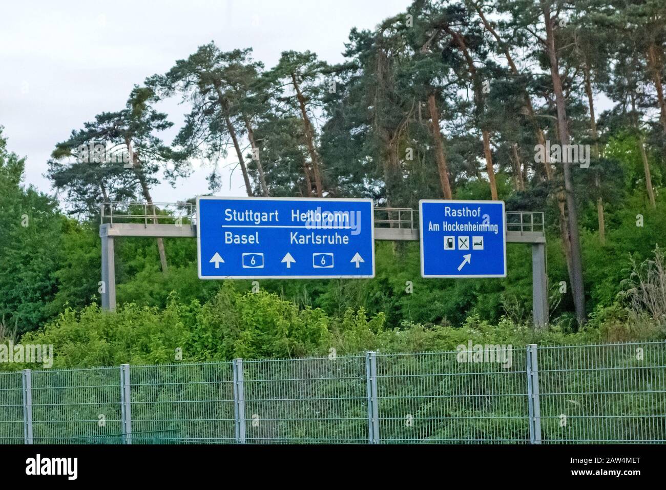 Highway signs at Autobahn A6 showing the way to the racetrack named Hockenheimring Stock Photo