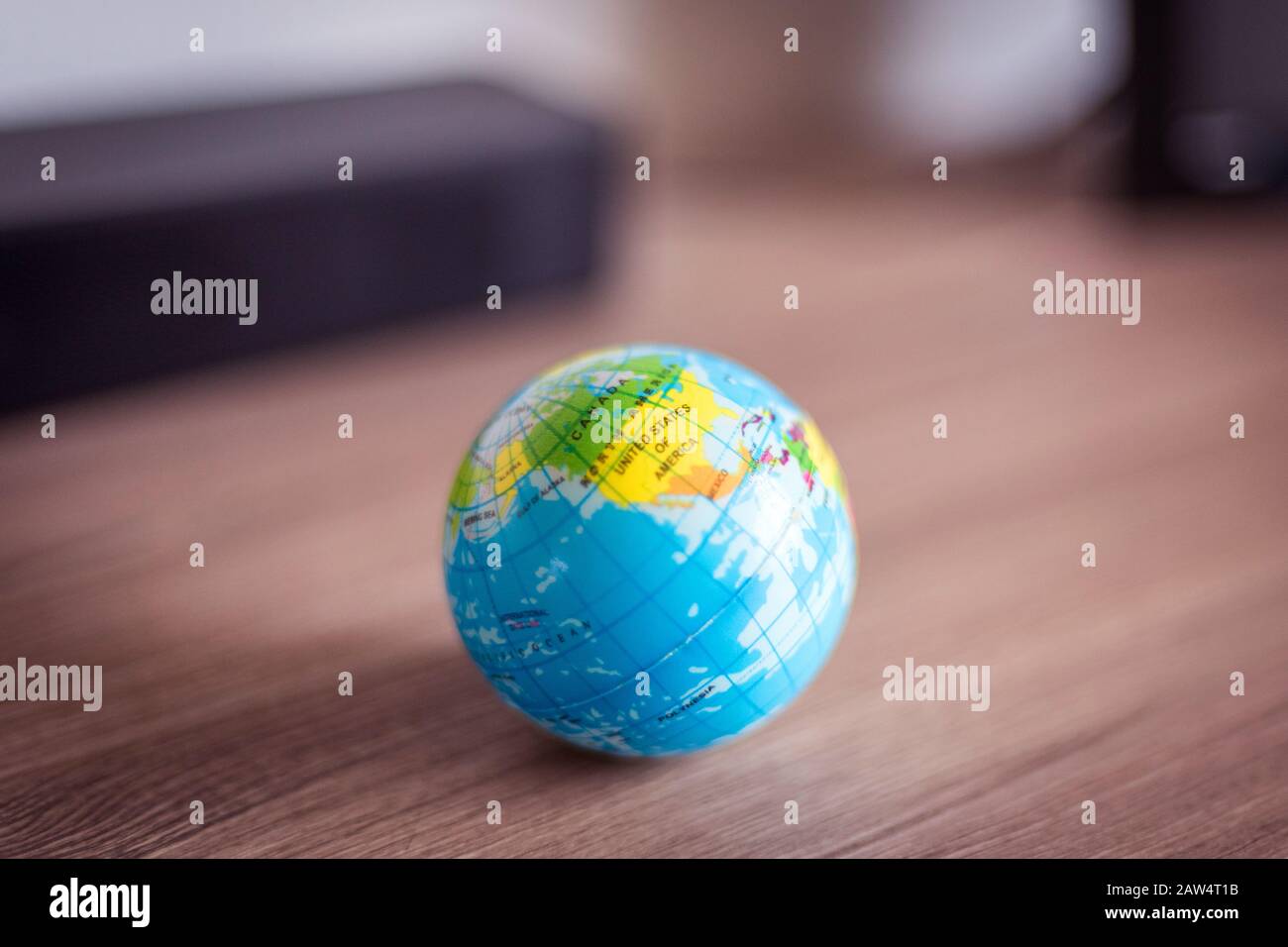 The USA on a small globe on a wooden surface Stock Photo