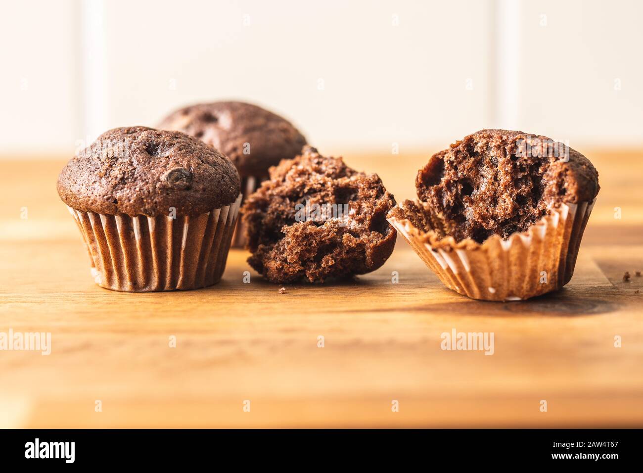 Sweet muffins. Chocolate cupcakes on kitchen table. Stock Photo