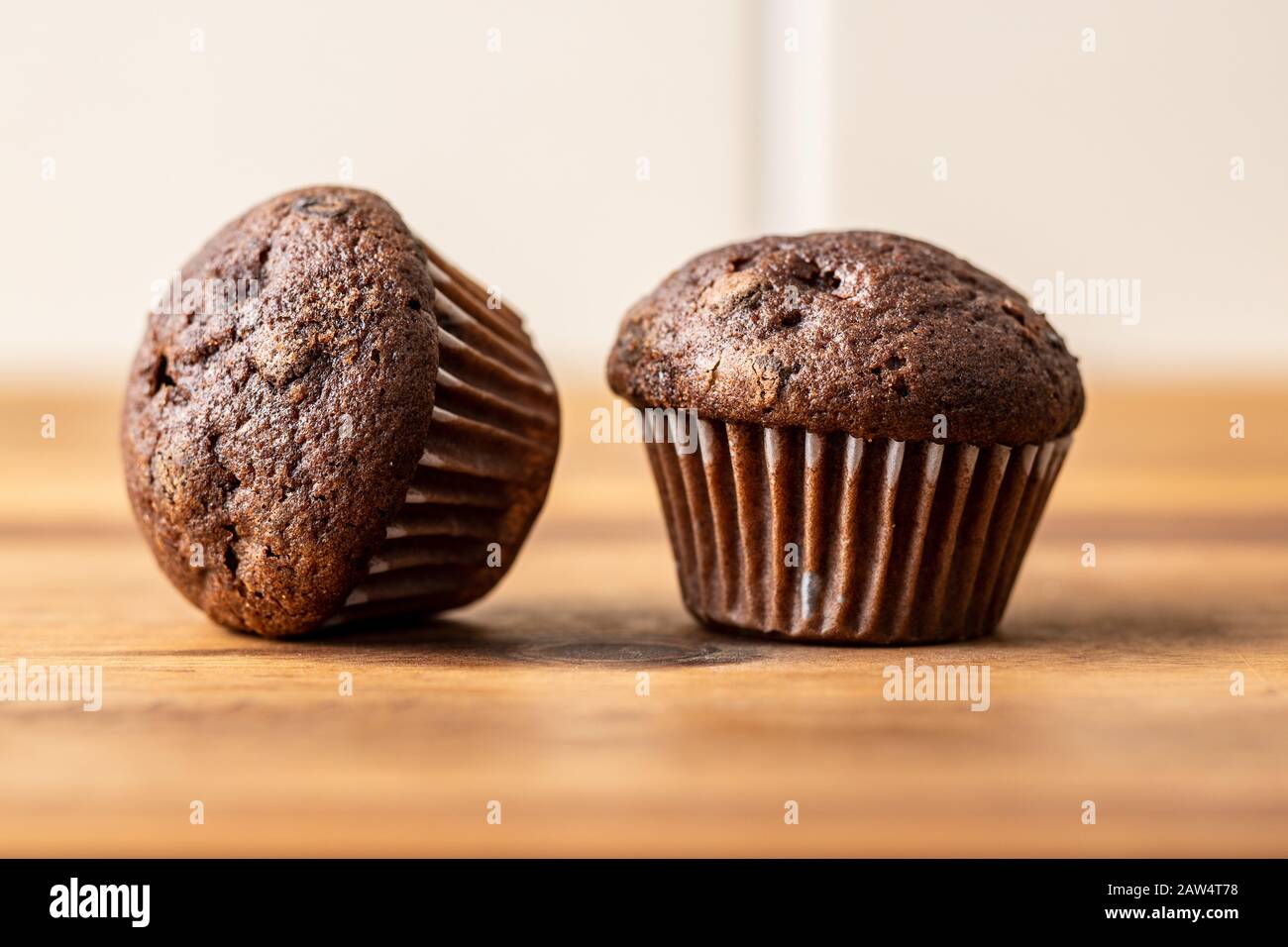 Sweet muffins. Chocolate cupcakes on kitchen table. Stock Photo