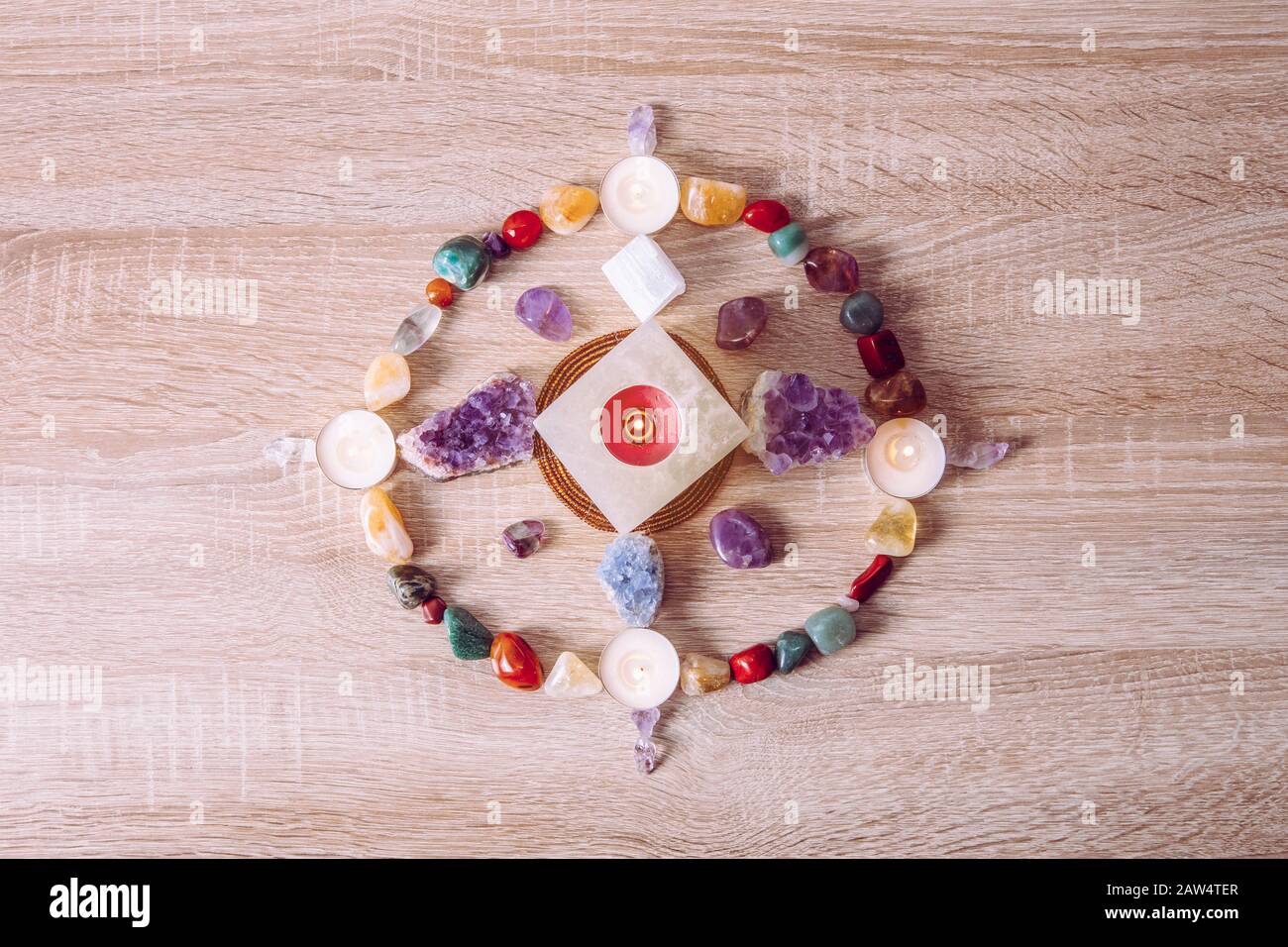 Setting up a semi precious stone crystal grid in home helps your intentions to manifest concept. Alternative lifestyle. Stock Photo