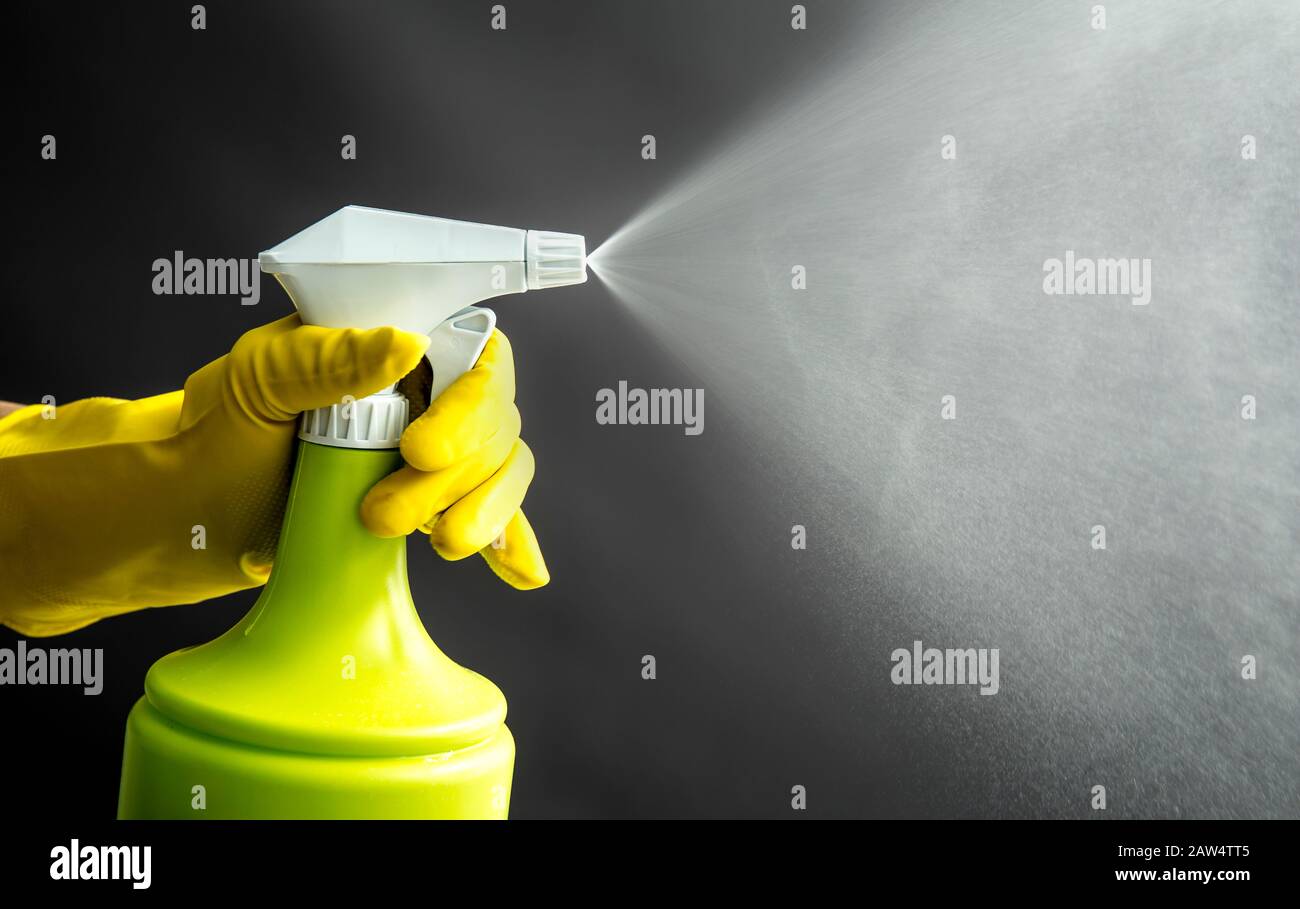 Download Woman Wearing Yellow Rubber Gloves Using Green Spray Bottle And Spraying Liquid Mist In Air Cool Lighting Effect Lot Of Copy Space Stock Photo Alamy PSD Mockup Templates