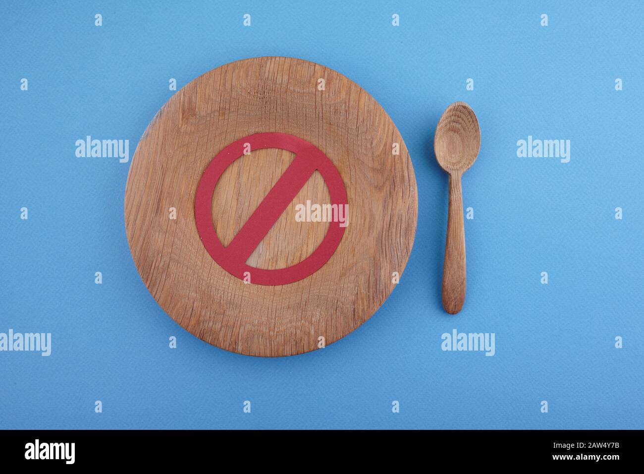 Skip breakfast concept with no symbol on wooden plate. Flat lay Stock Photo