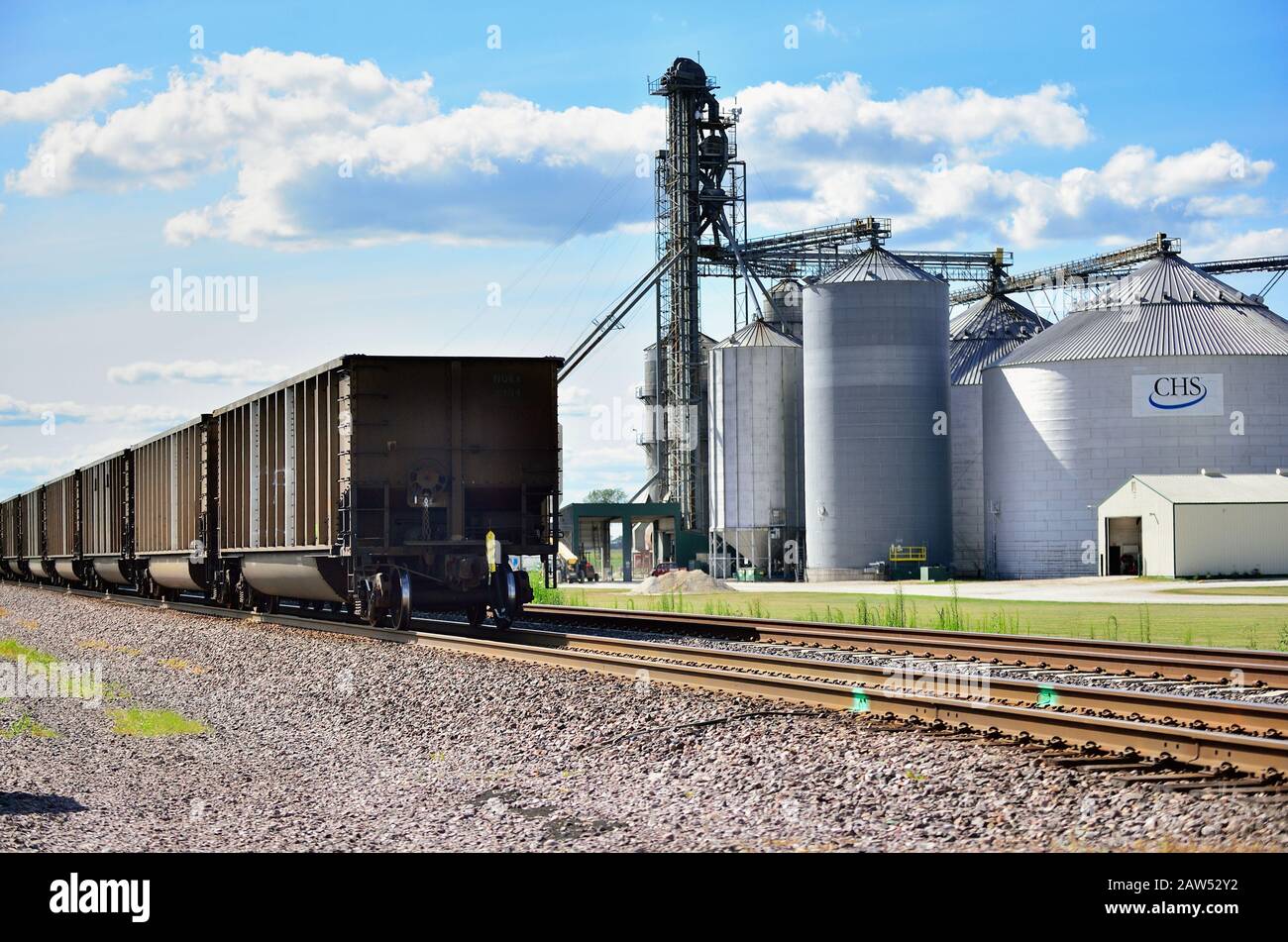 Elburn, Illinois, USA. A Union Pacific freight train passing a large farming cooperative in northeastern Illinois. Stock Photo