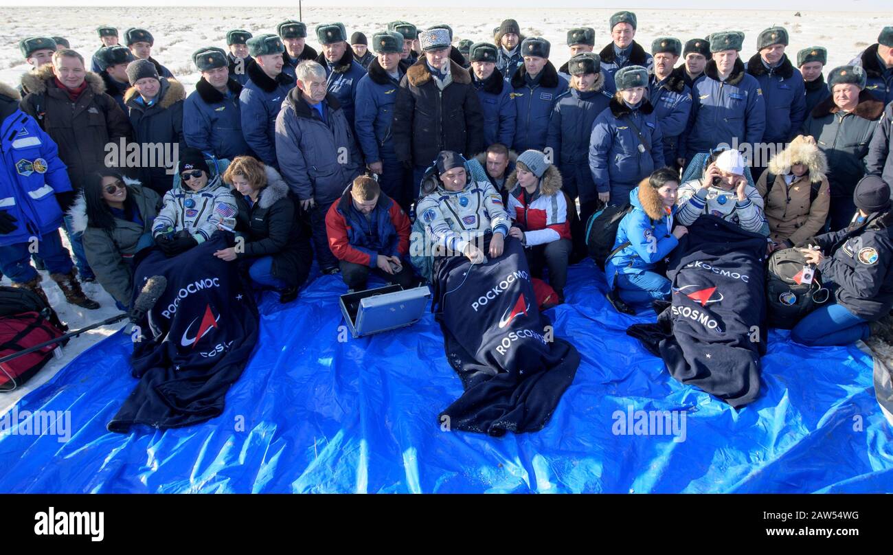 Zhezkazgan, Kazakhstan. 06th Feb, 2020. NASA astronaut Christina Koch, left, Roscosmos cosmonaut Alexander Skvortsov, center, and ESA astronaut Luca Parmitano sit in chairs outside the Russian Soyuz MS-13 spacecraft moments after landing in a remote area February 6, 2020 near the town of Zhezkazgan, Kazakhstan. Koch returned to Earth after logging 328 days in space, the longest spaceflight in history by a woman, as a member of Expeditions 59-60-61 on the International Space Station. Credit: Bill Ingalls/NASA/Alamy Live News Stock Photo