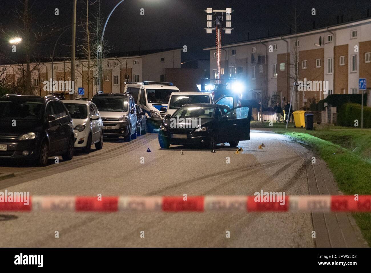 Hamburg, Germany. 06th Feb, 2020. Number plates are on a civilian police vehicle and the van behind it at the scene of the operation in the Felix-Jud-Ring. Officials had stopped the white rented van there to arrest a person. During the arrest a second car drove up to the officers. Several shots were fired, nobody was injured. Credit: Jonas Walzberg/dpa - ATTENTION: The license plate of the civilian vehicle was pixelated on the instructions of the police/dpa/Alamy Live News Stock Photo