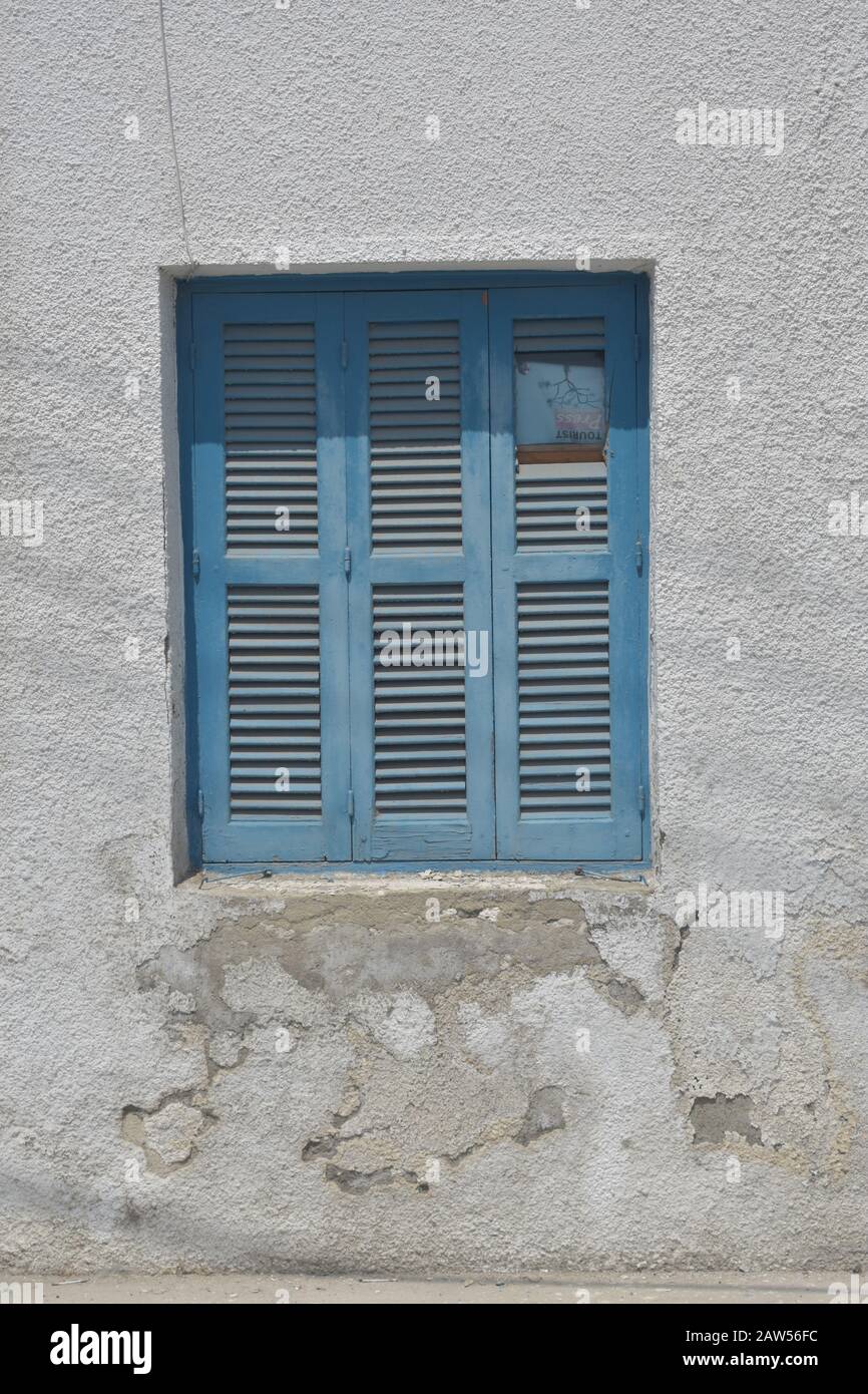 Blue window on a white building in larnaca Stock Photo - Alamy