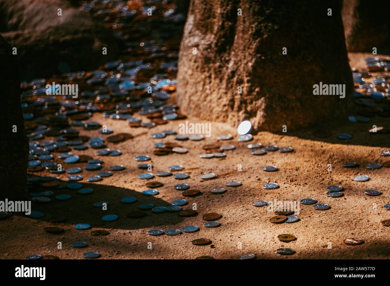 Money on the floor. Someone throw or dropped coins on the ground. Dirty