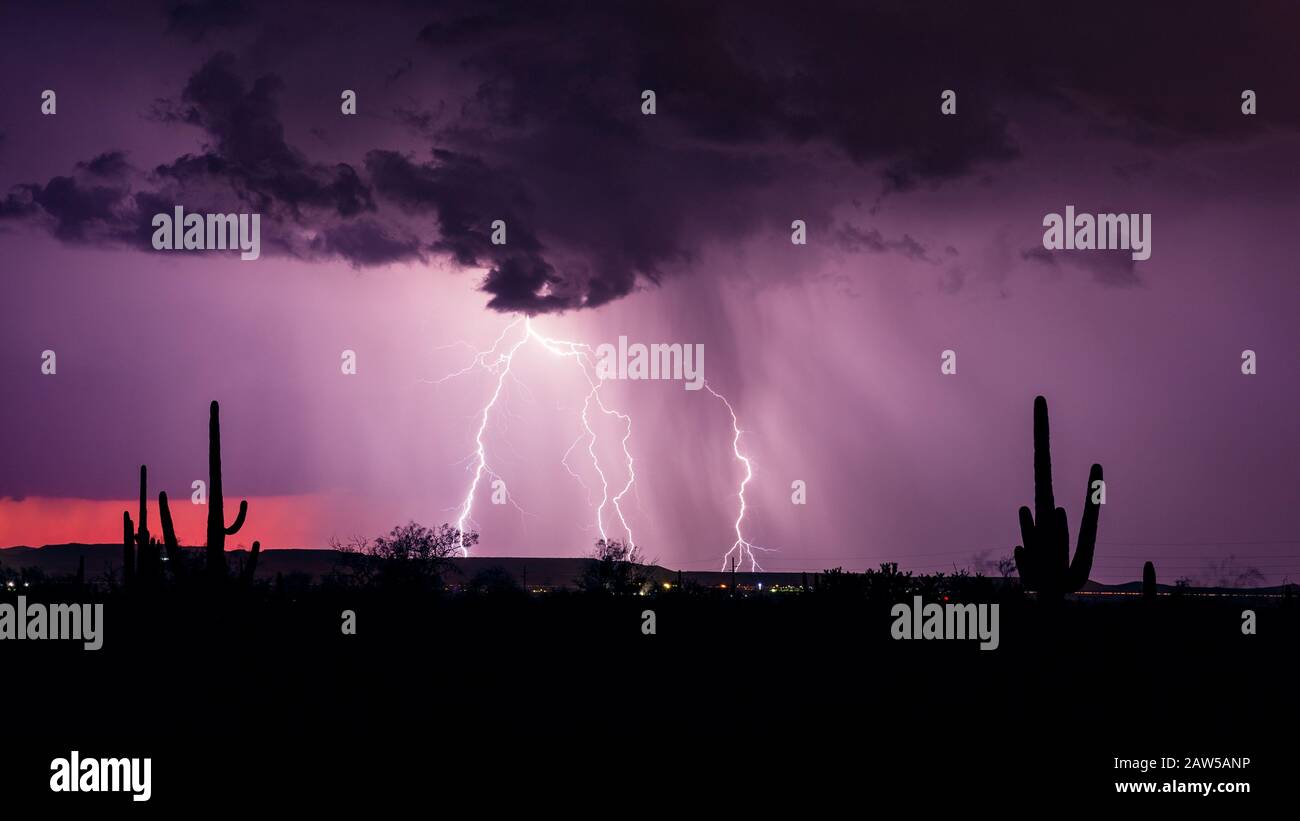 A strong monsoon storm with lightning and heavy rain moves through the desert near Tucson, Arizona. Stock Photo