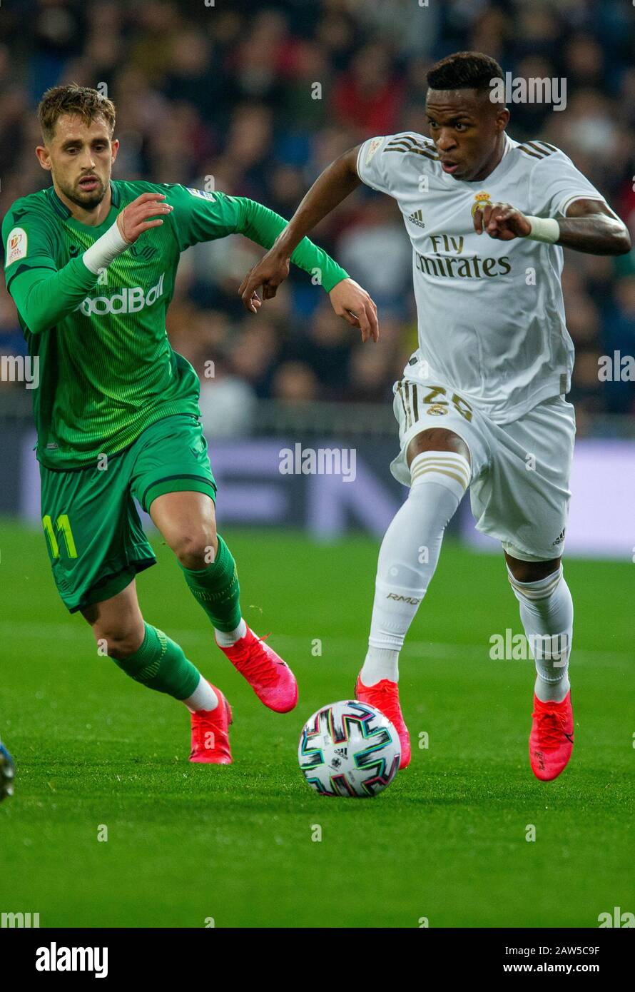 Real Madrid CF's Vinicius Jr and Real Sociedad's Adnan Januzaj are seen in action during the Spanish quarterfinal Copa del Rey match between Real Madrid and Real Sociedad at Santiago Bernabeu Stadium in Madrid.(Final score; Real Madrid 3:4 Real Sociedad) Stock Photo
