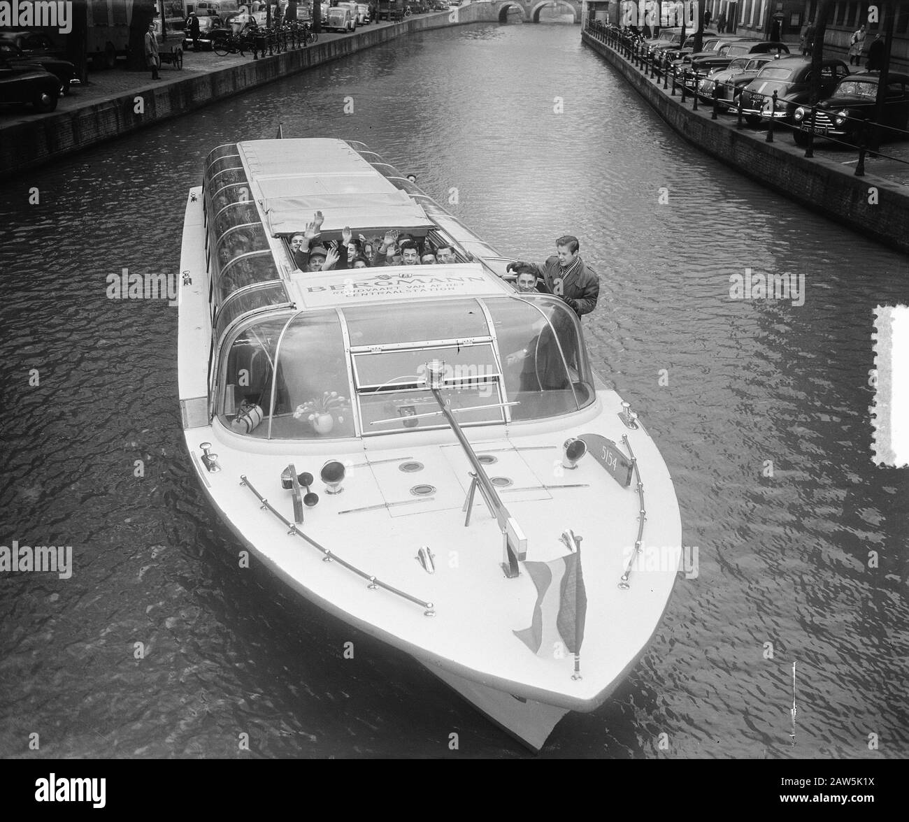 Parisian children have money from Disaster to Mayor of Amsterdam. Roundtrip Date: April 1, 1953 Location: Amsterdam, Noord-Holland Keywords: mayors, children, excursion boats Stock Photo