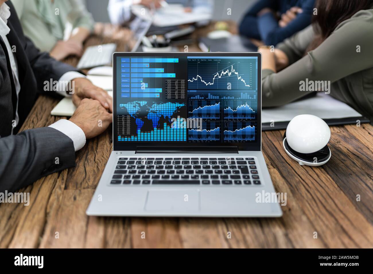 Close-up Of Male And Female Businesspeople In Meeting Discussing Graphs Stock Photo