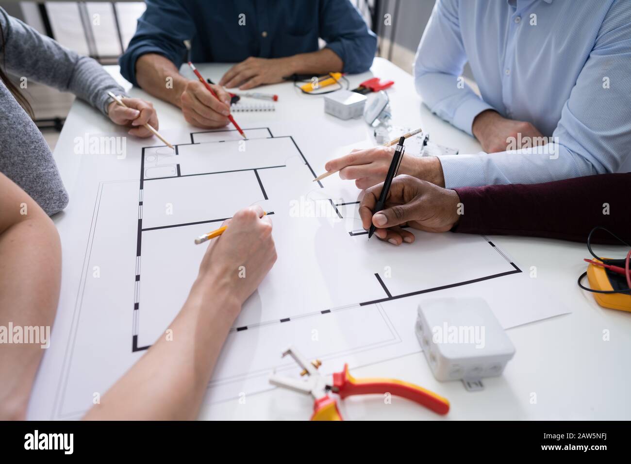 Elevated View Of An Architects Drawing Plan On Blueprint With Electrical Components Stock Photo