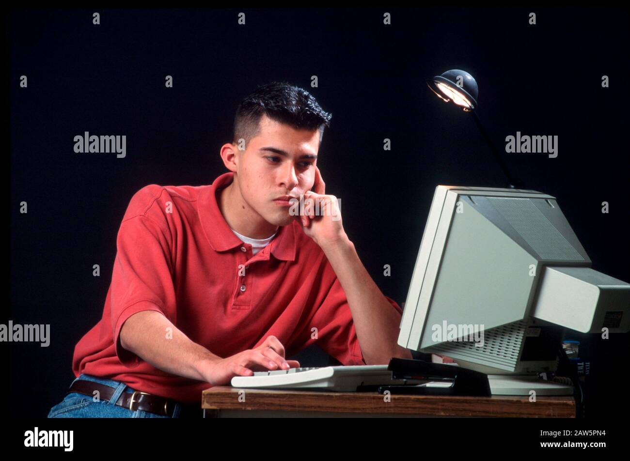 Latino boy on computer hi-res stock photography and images - Alamy