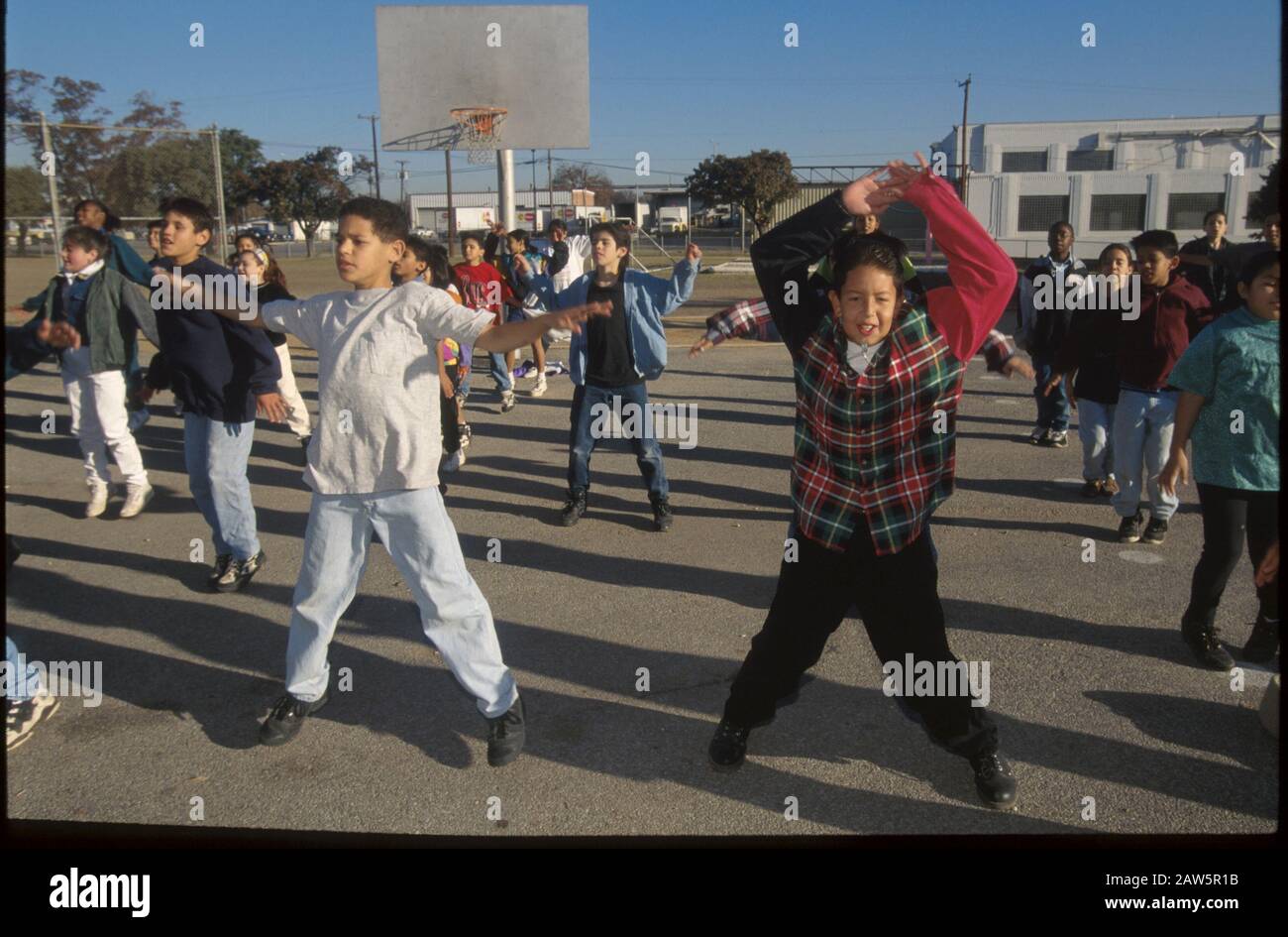 San Antonio, Texas: Fifth graders exercising on playground. ©Bob Daemmrich Stock Photo