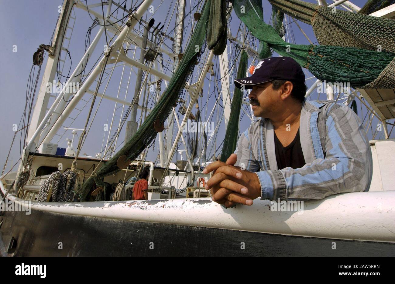 Shrimp boat captain Victor Martinez awaits the arrival of Hurricane Rita on the Texas Gulf Coast near Matagorda Island. Stock Photo