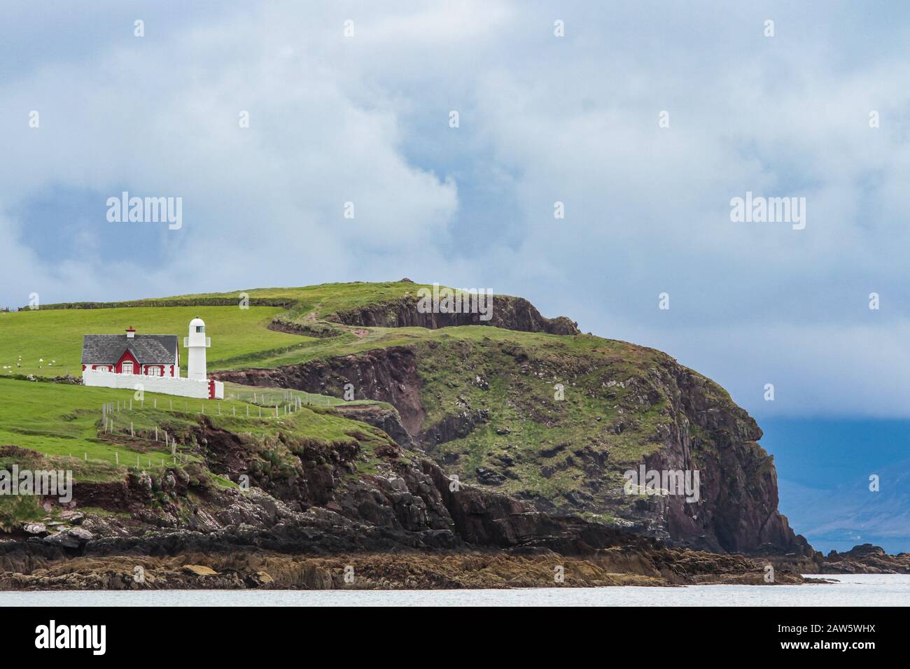 Dingle Lighthouse on cliff coast of Dingle peninsula, nearby Dingle harbor, County Kerry, Ireland, Europe Stock Photo
