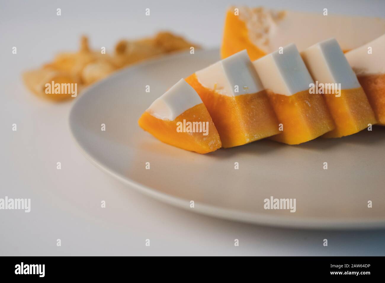 Delicious papaya milk jelly, sliced on a plate. Home made dessert. The