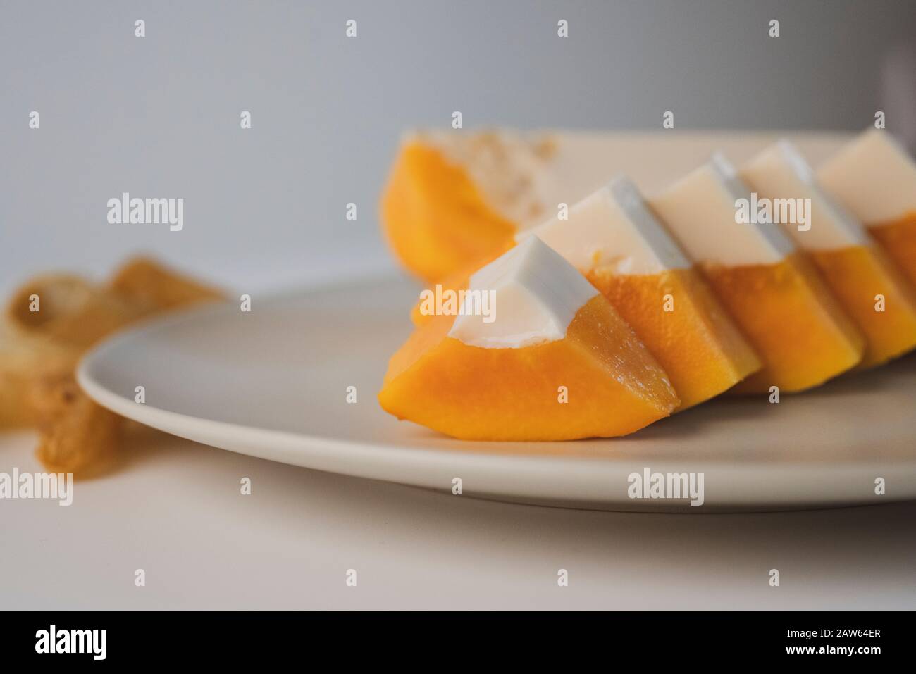 Delicious papaya milk jelly, sliced on a plate. Home made dessert. The