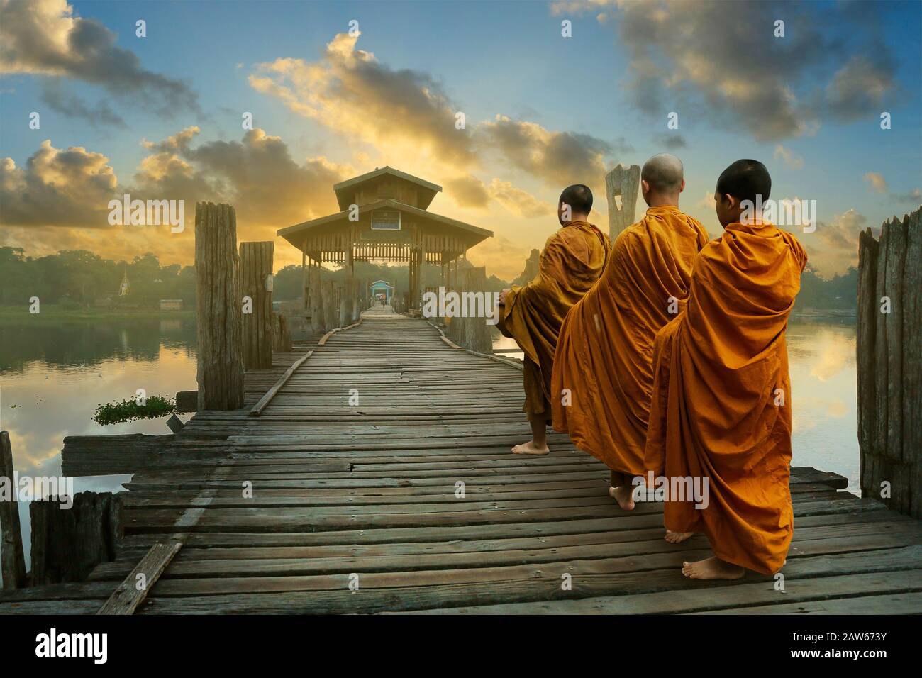 monks with orange robe ,walking on U bain bridge at Mandalay,Myanmar ...