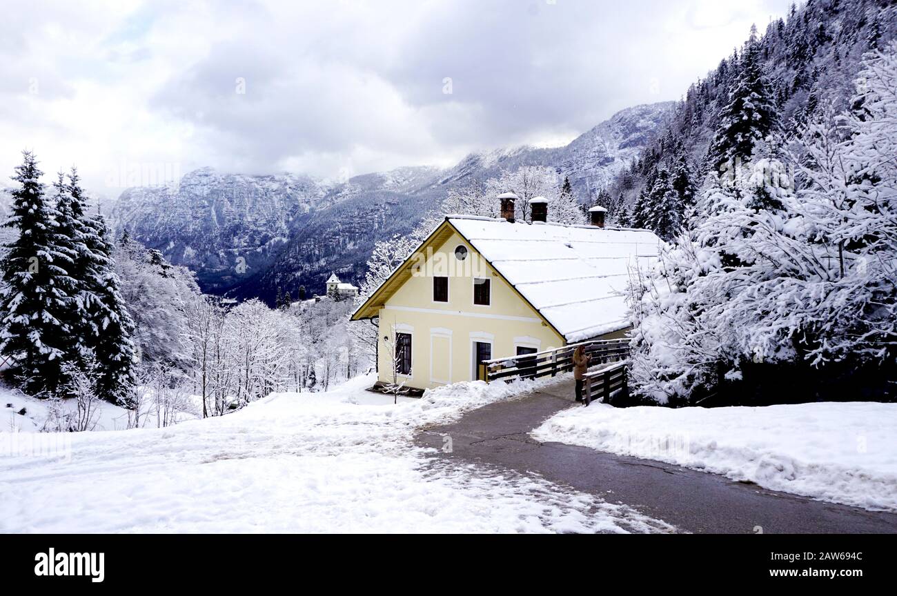 Hallstatt Winter snow mountain landscape and the architectural building house in upland valley leads to the old salt mine of Hallstatt, Austria Stock Photo
