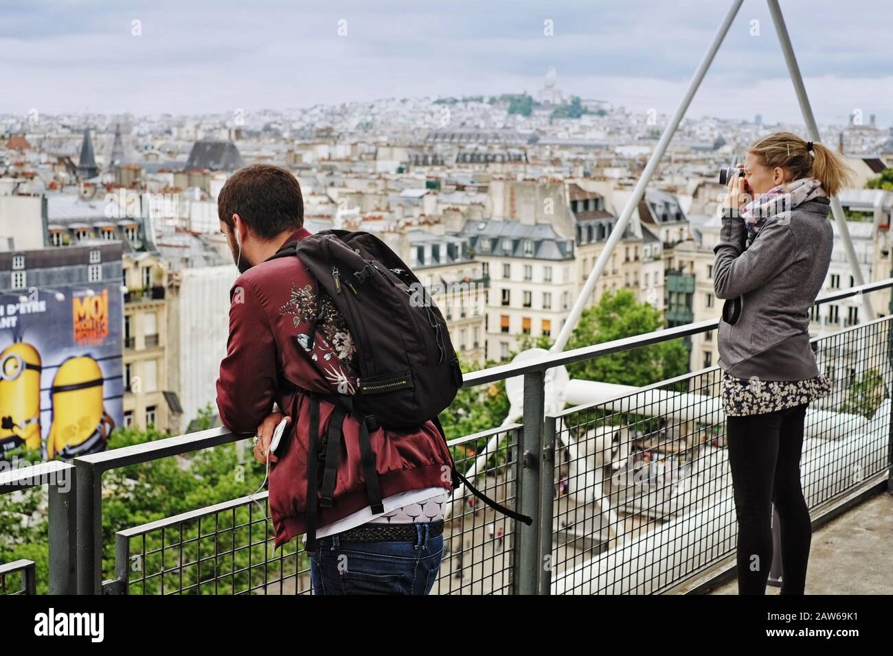 Travellers photograph Paris from the rooftop level of the Centre Pompidou views to Montmartre, and Sacré-Cœur on an overcast day Stock Photo