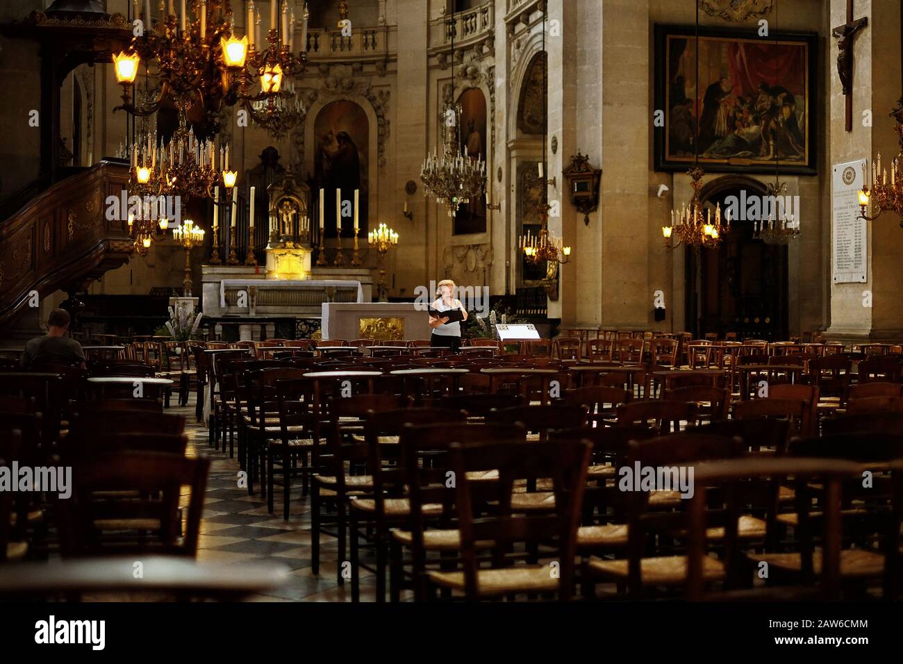 An opera singer rehearses with the organist at Paroisse Saint-Paul Saint-Louis Stock Photo