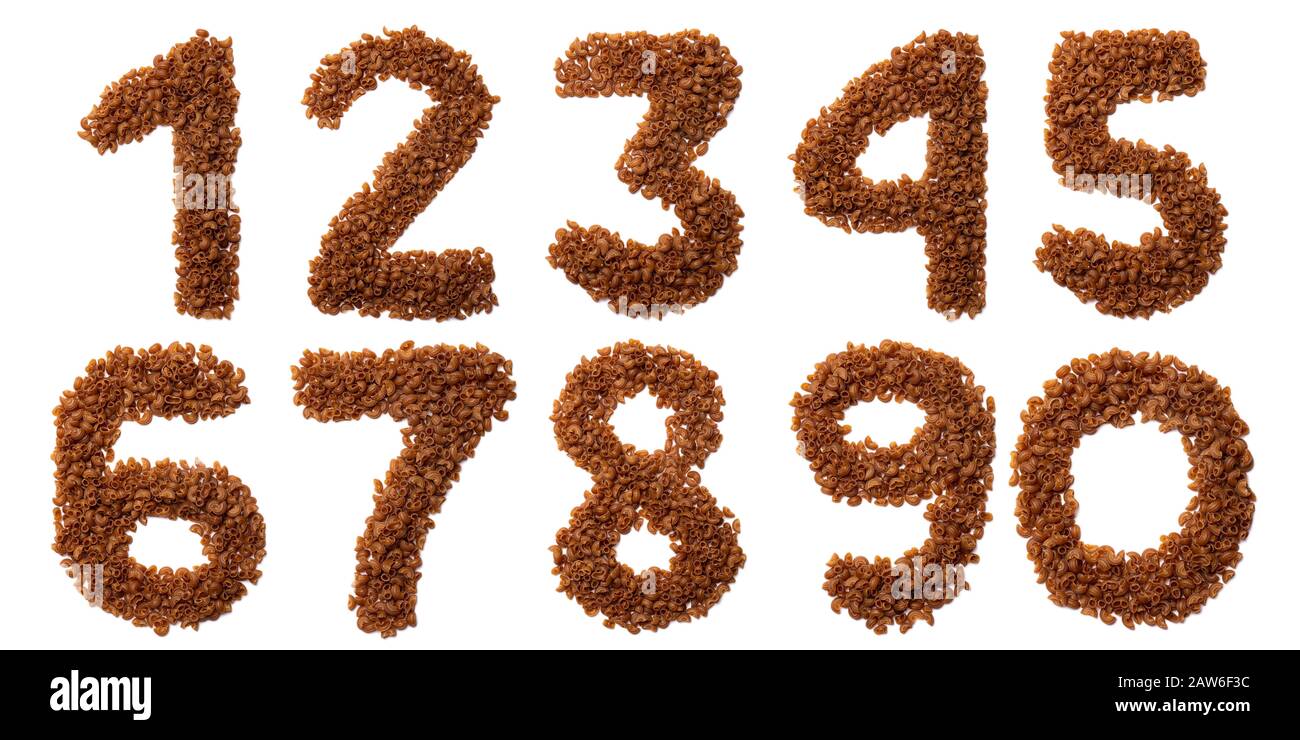 Arabic numerals from dry pasta from buckwheat amaranth flour on a white