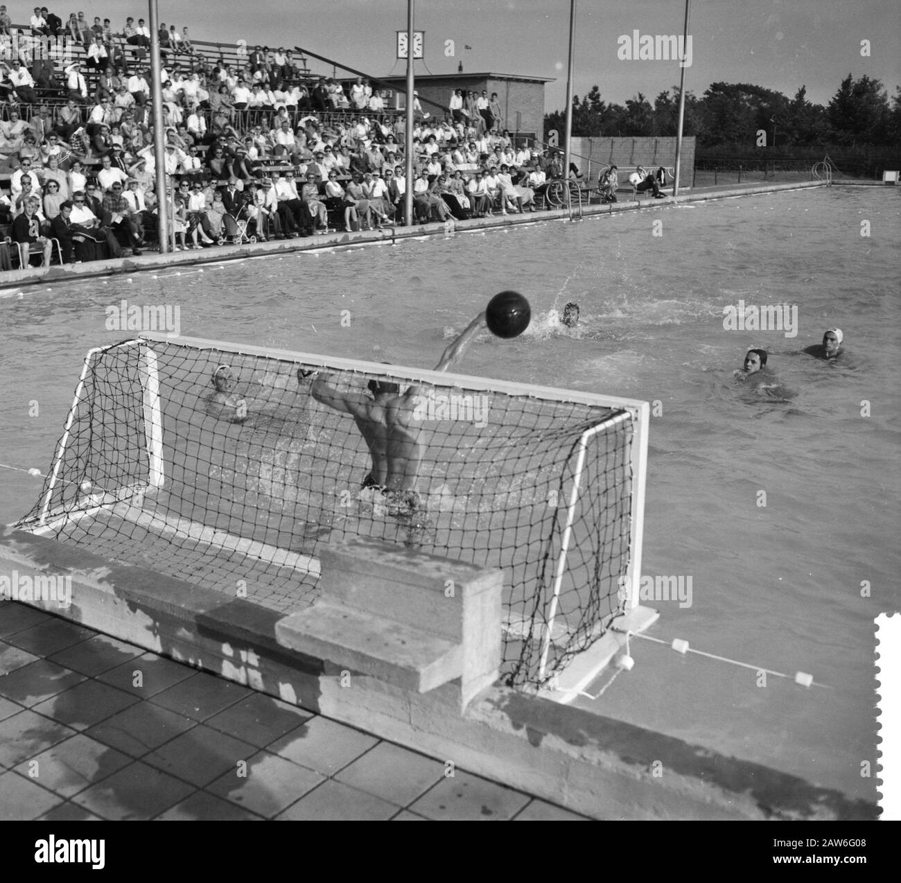 swimming contests Country Netherlands against Germany in Nijmegen. Waterpolo match Netherlands against Germany, game time for the German goal Date: July 19, 1958 Location: Nijmegen Keywords: sports, waterpolo Stock Photo