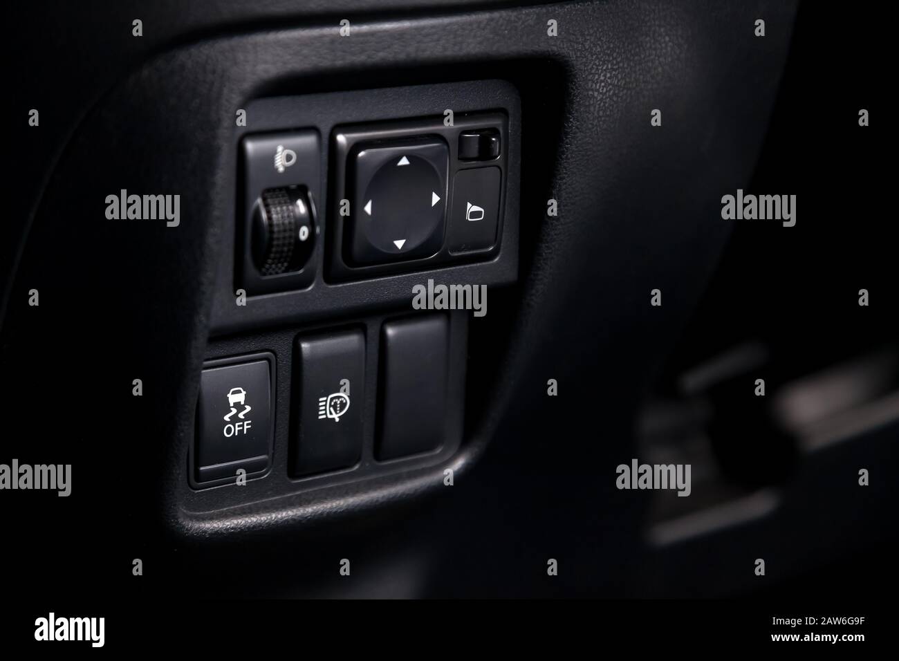 The button for the stability control system, side mirrors adjust and