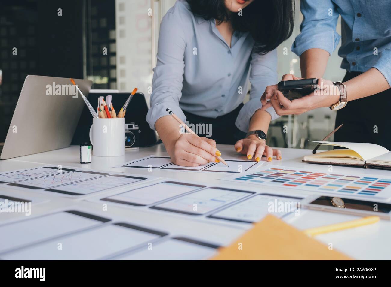 Programmer and UX UI designer working in a software development and coding technologies. Mobile and website design and programing development technolo Stock Photo