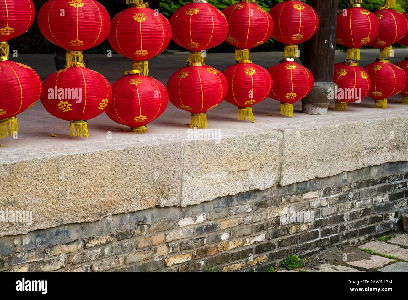 Red lanterns hanging on the old wooden building Stock Photo - Alamy