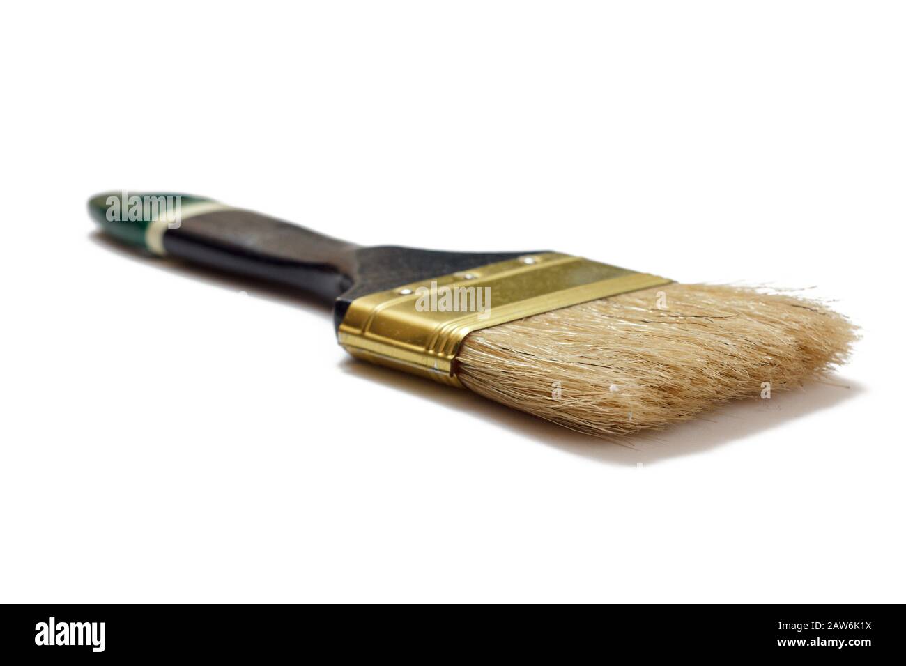 House painter brush on a white isolated background. Repair tool. Building tool. Close-up view. Stock Photo