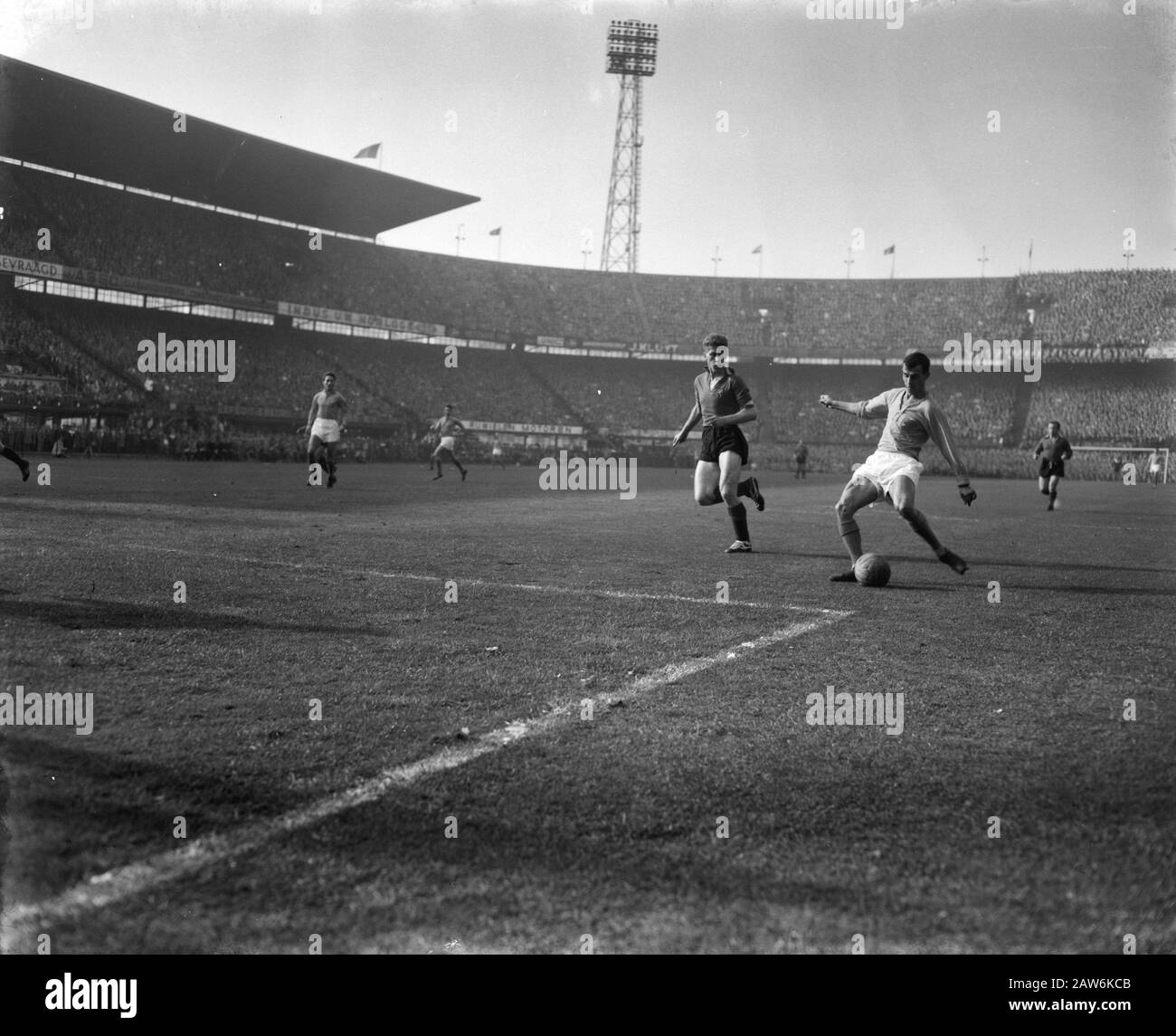 Netherlands against Belgium 9-1. Coen Moulijn in Action Date: October 4, 1959 Location: Rotterdam, South Holland Keywords: sport, football Person Name: Moulijn Coen Stock Photo