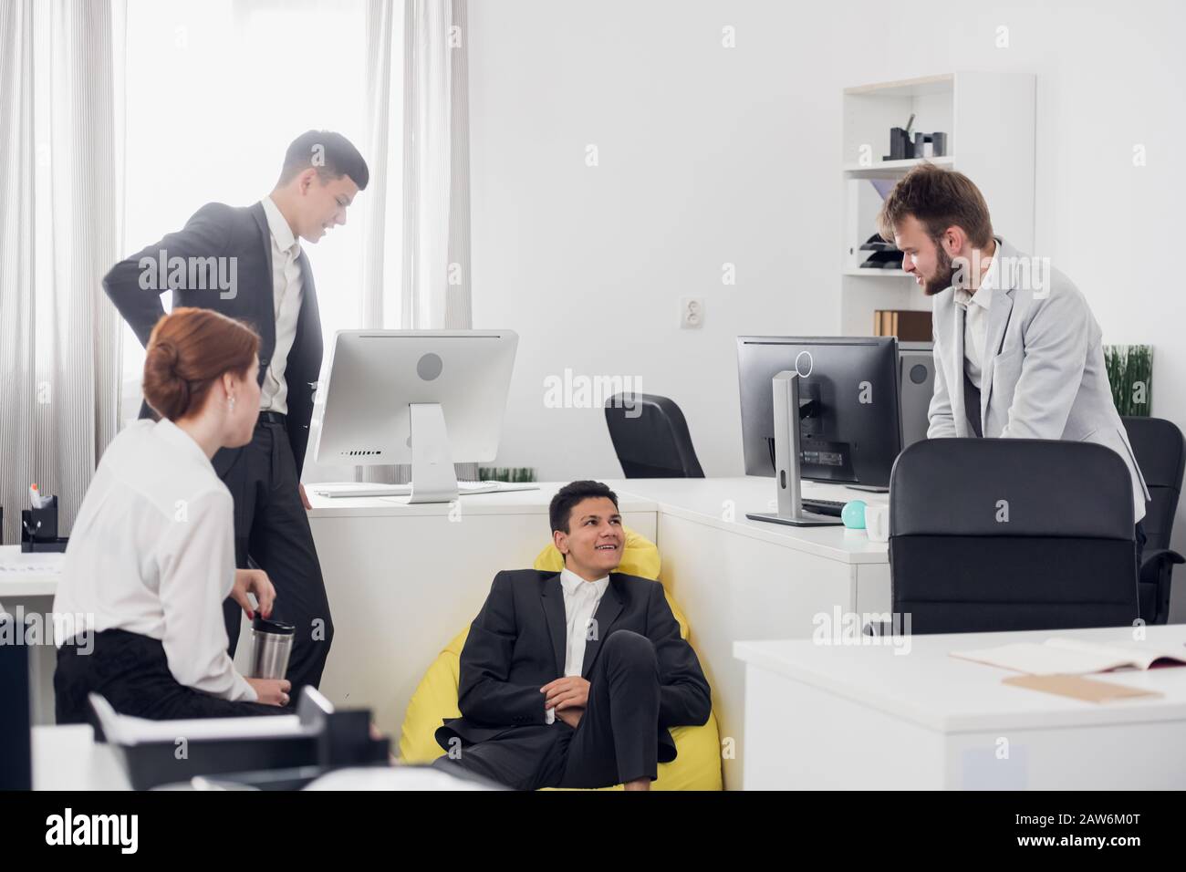 Colleagues men in suits talking hi-res stock photography and images - Alamy