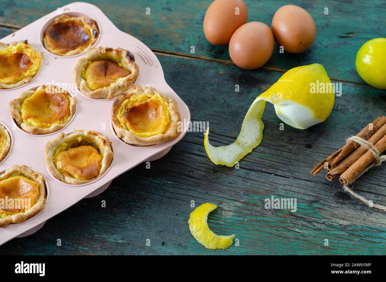 Portuguese egg tart pastry Pastel de nata on the wooden table, Stock Photo