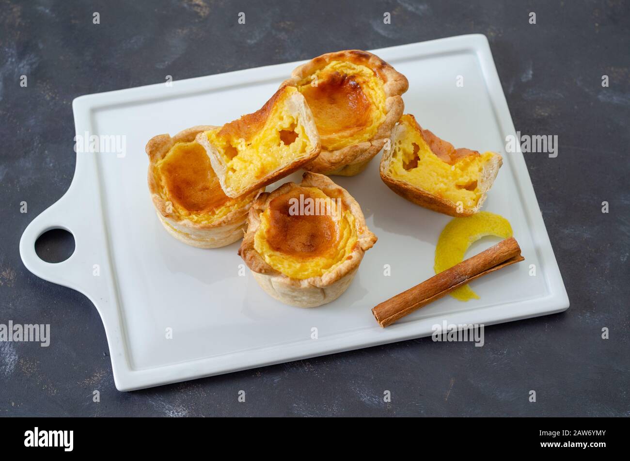 Portuguese egg tart pastry Pastel de nata on the white plate Stock Photo
