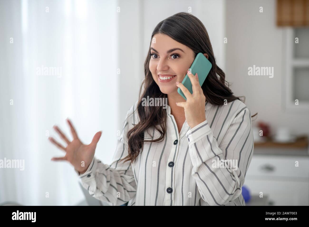 Young pretty woman in a striped blouse hi-res stock photography and ...