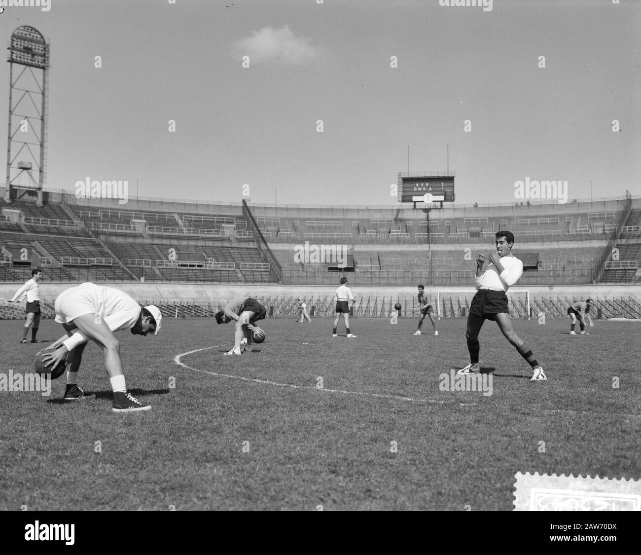 Training of Mexican soccer in the Olympic Stadium  [Mexican footballers throw balls over] Annotation: Left might Mexican trainer Ignacio Trelles Date: April 18, 1961 Location: Amsterdam Keywords: sports stadiums, football, football, football Stock Photo