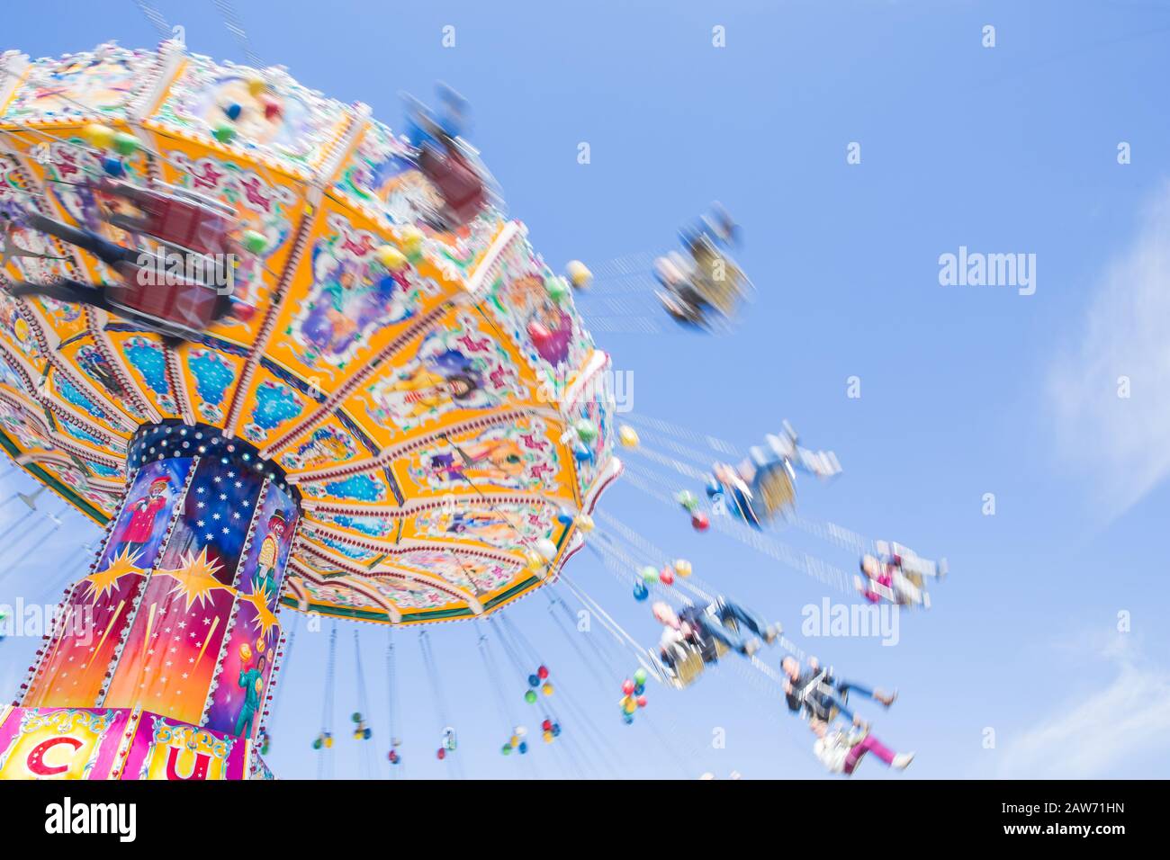 Chain carousel ride in an amusement parks carnivals or funfair, Munich, German Stock Photo
