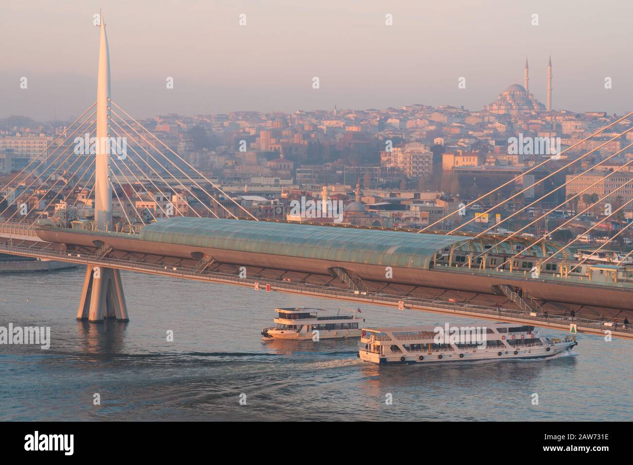 Istanbul, Turkey - Jan 14, 2020:  Halic Bridge over the Golden Horn and the Galata Tower, Istanbul, Turkey Stock Photo