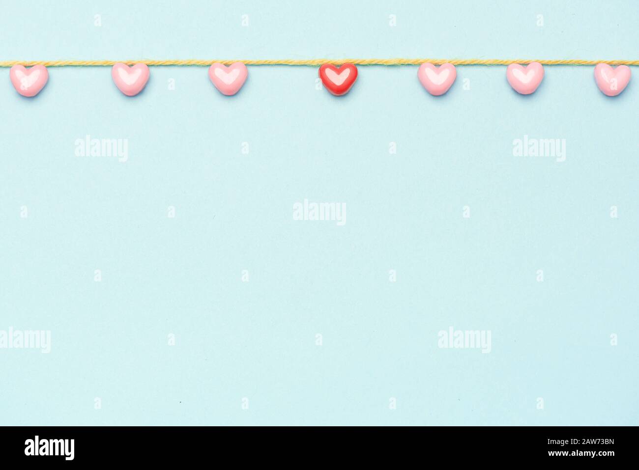 Valentine's Day background. Pink hearts on pastel blue background ...