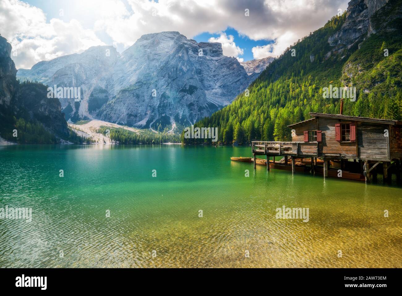 Braies Lake in Dolomites mountains Seekofel in background, Sudtirol, Italy. Lake Braies is also known as Lago di Braies. The lake is surrounded by the Stock Photo