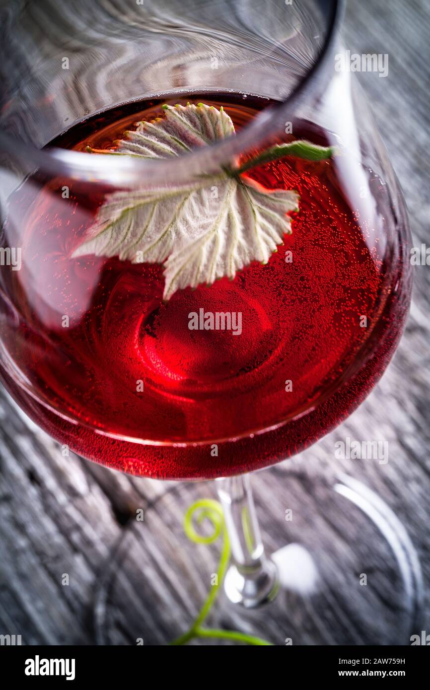 vine leaf in a glass of red wine Stock Photo - Alamy
