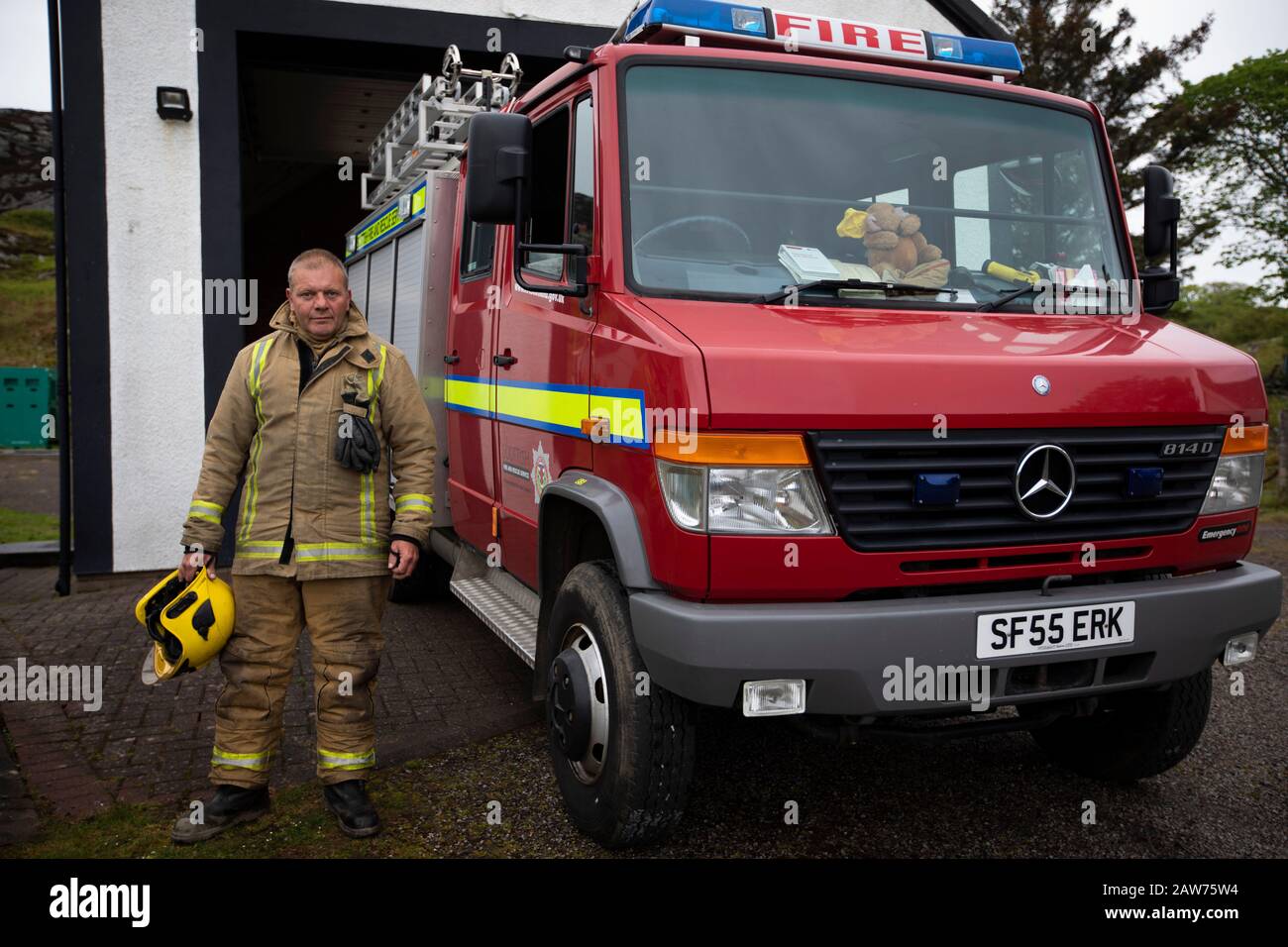 Volunteer fire fighter Les Robinson pictured during a training drill on the the Inner Hebridean island of Colonsay on Scotland's west coast.  The island is in the council area of Argyll and Bute and has an area of 4,074 hectares (15.7 sq mi). Aligned on a south-west to north-east axis, it measures 8 miles (13 km) in length and reaches 3 miles (4.8 km) at its widest point, in 2019 it had a permanent population of 136 adults and children. Stock Photo