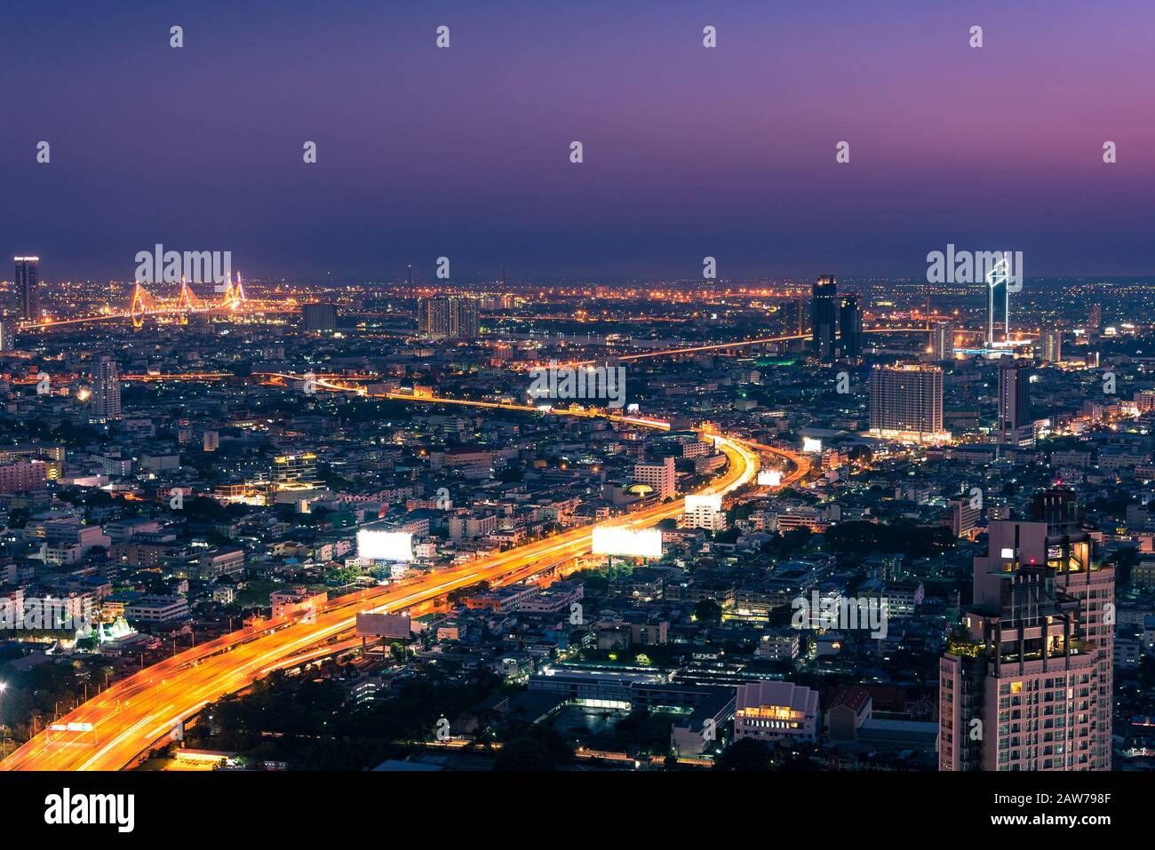 Aerial panoramic view of Bangkok cityscape at night with highway full ...