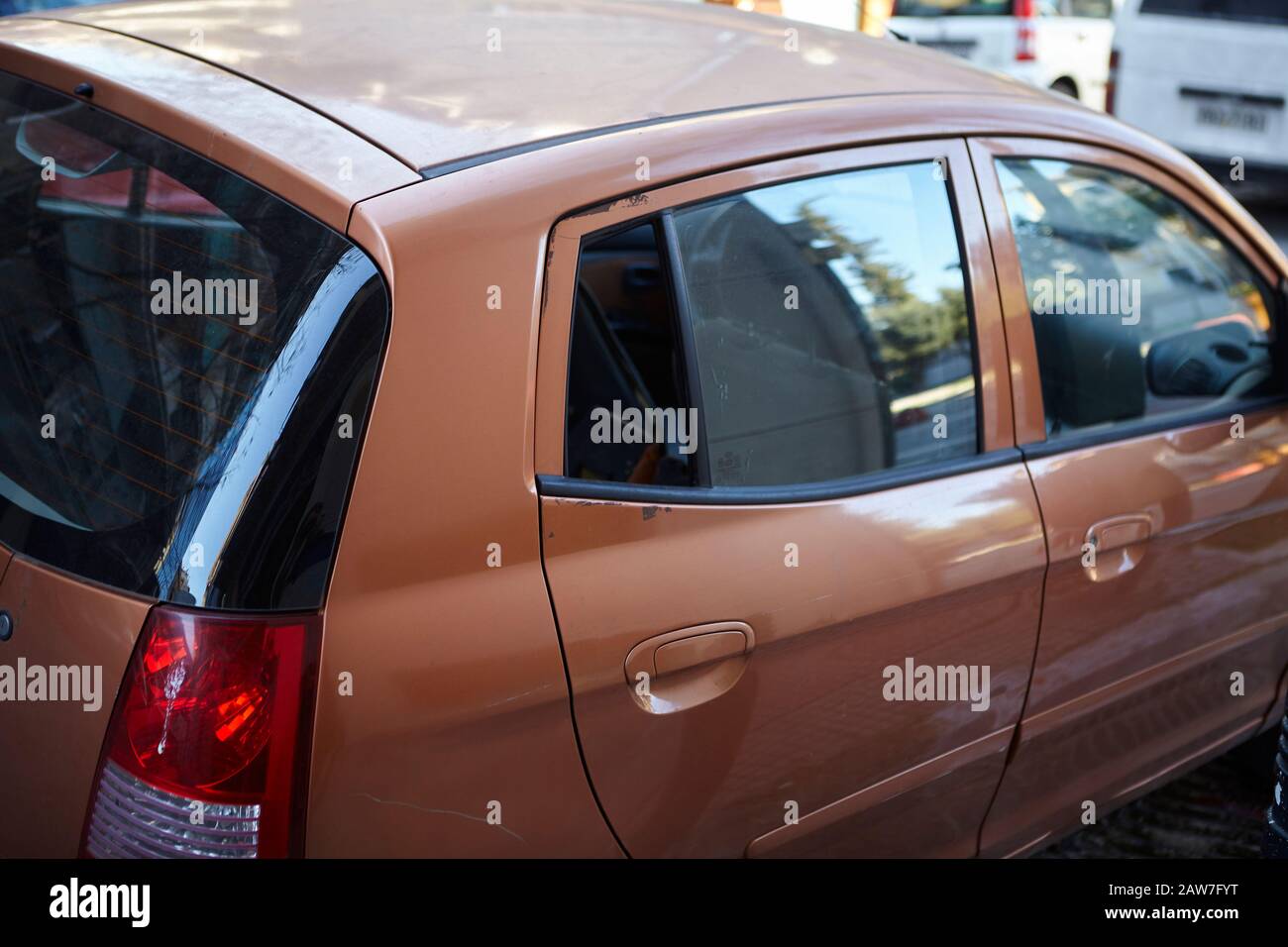 Broken smashed window on a car at metaxourgeio Athens Stock Photo